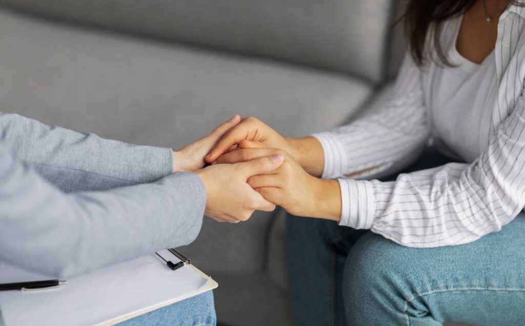 Therapist providing emotional support to her client.
