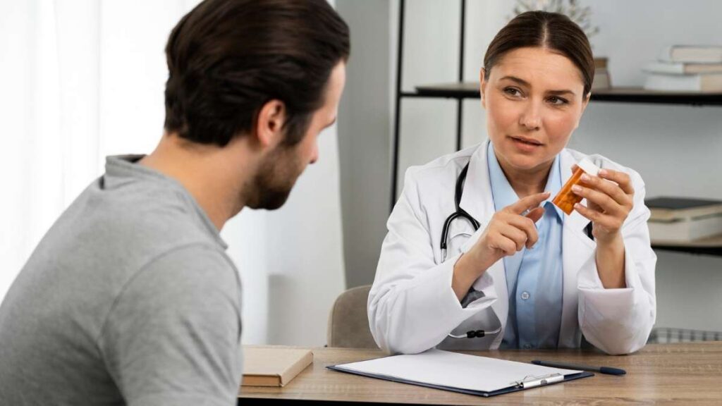 A man talks to his doctor about medication assisted treatment in denver.