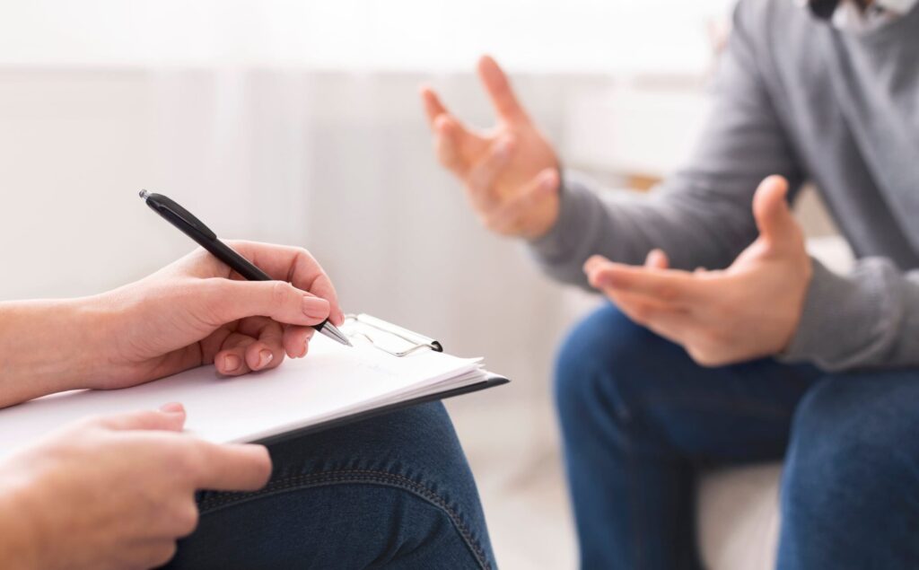 A professional conducts assessments as part of Denver depression treatment.