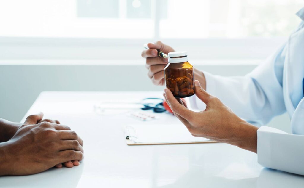Doctor explaining benzodiazepine use and treatment to a client.
