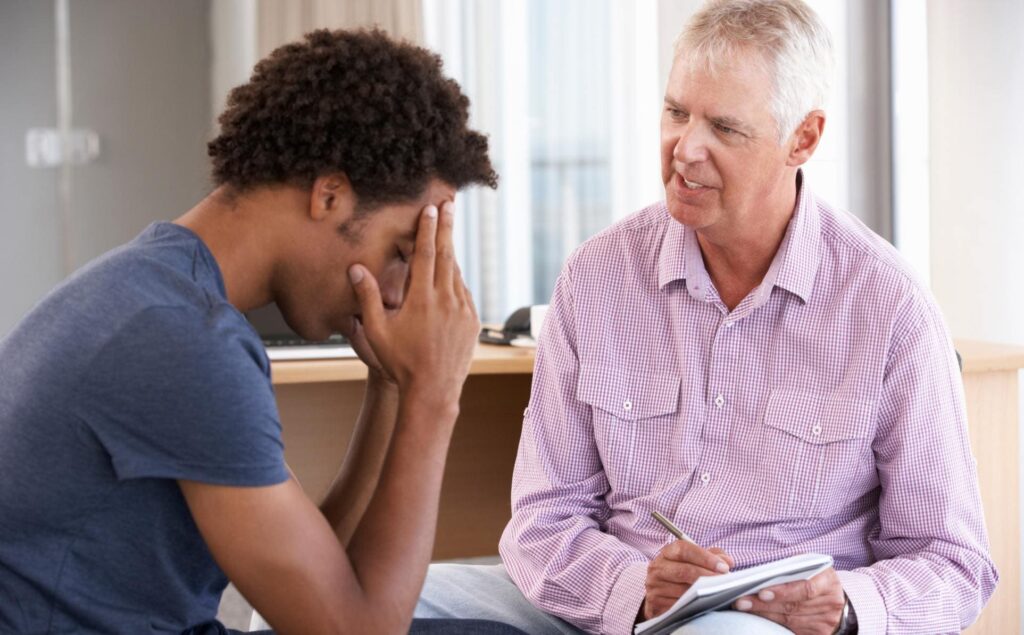 Man engaged in therapy for morphine addiction treatment in Denver, Colorado.